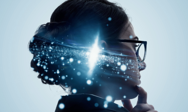 Profile of a woman with glasses and a digital overlay to represent AI technology