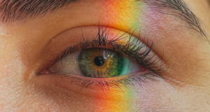 Light Therapy in Focus: Advancing Treatment Options for ODs a strip of rainbow light on a woman's eye