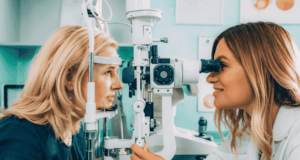 The 4 Most Overlooked Issues in Optometry Right Now optometrist examining a patient in a clinic