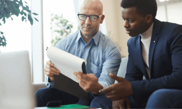 Tips for shadowing for practicing ODs Two guys, seated, looking at a document together