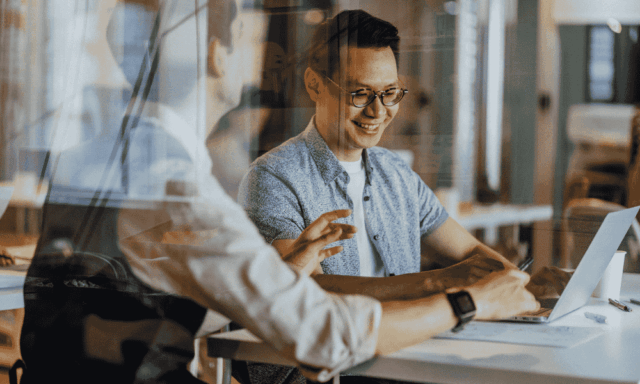 Two work colleagues collaborating at a table