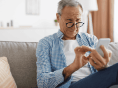 Patients Trust These Online Vision Tests. Know the Brands, Share the Risks Man with glasses squinting at his phone