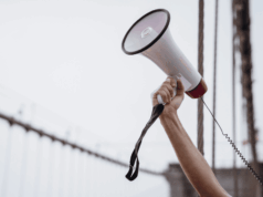 VBM Lobby Under Fire: Optometry Pushes Back in Washington Outstretched arm holding a megaphone