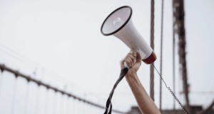 VBM Lobby Under Fire: Optometry Pushes Back in Washington Outstretched arm holding a megaphone