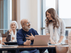 Last Call for CE Hours: In-Person and On-Demand Events To Close Out 2025 People sitting at tables at a conference presentation