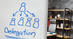 What You Can Stop Approving (and Still Keep Your Practice Running Smoothly) Whiteboard in an office that says "delegation"