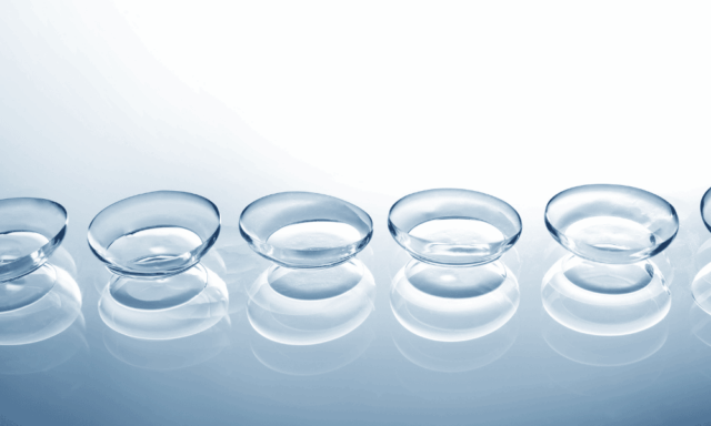 a line of contact lenses on a mirrored surface