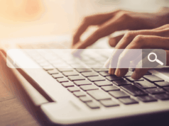 When Patients Bring Internet Diagnoses: How To Handle It Gracefully hands typing on a laptop, with a search bar overlay