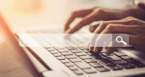 When Patients Bring Internet Diagnoses: How To Handle It Gracefully hands typing on a laptop, with a search bar overlay